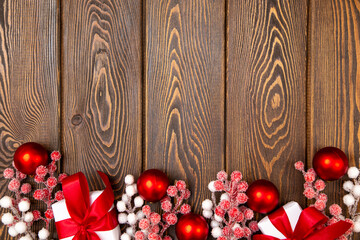 Merry Christmas and Happy New Year greeting card background with red ornaments, gift boxes, frosted...