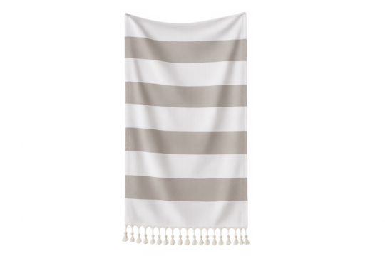 Striped beach towel with tassels hanging, ready for summer