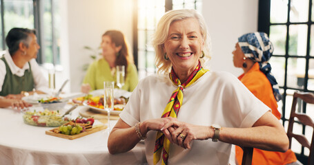 Happy, dinner and portrait of mature woman in home with friends for reunion, bonding or catch up. Smile, connection and female person in dining room for supper, brunch or meal with people in house.