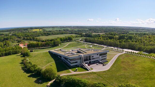 Drone footage of Moesgaard Museum&rsquo;s modern architecture set against lush green surroundings
