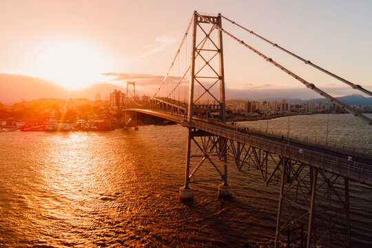 Hercilio luz old bridge with sunset light in Florianopolis city, Brazil. Aerial view
