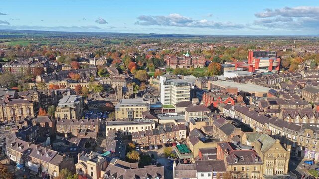 Aerial panorama of Harrogate reveals the Convention Centre, stone Victorian streets, hospital blocks, and a horizon blending town and rural landscapes
