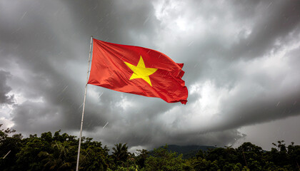Vibrant Vietnam flag waves bravely against a moody sky, symbolizing resilience and national pride in the face of a tropical storm, a powerful cultural icon