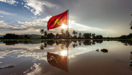 Stunning Vietnam flag waving proudly over tranquil rice paddy reflecting sunset with vibrant color, evoking national pride and serene beauty of Southeast Asia