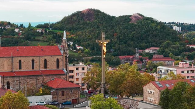 Aerial shot around the Colline des Peres in Saint Etienne city with Saint Mary's church and the Puit Couriot in the background, Loire departement, Auvergne Rhone Alpes region, France