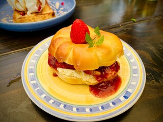 Fresh Strawberry Bagel with Cream and Jam Filling, Stylish Cafe Brunch Photography