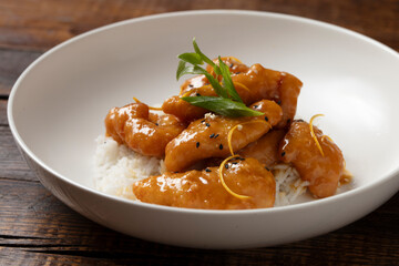 Orange Chicken and rice on a white plate 