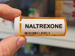 Box of NALTREXONE tablets on a hospital pharmacy table used to treat opioid and alcohol dependence an opioid antagonist.