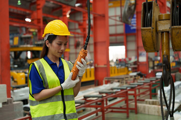 A supervisor is inspecting a component production line in a sheet metal and metal roofing...