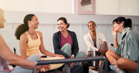 Smile, people and friends talk for pilates with fitness feedback, training tips and progress. Group, woman and discussion on reformer for exercise, explain technique and advice with wellness session