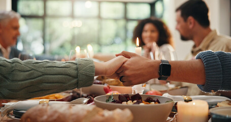 Holding hands, family dinner or people praying at table, christian practice or blessing food for gratitude. Thanksgiving feast, religion or group together for meal, worship and praise god at reunion