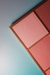 Fototapeta premium Makeup palette with blush and eyeshadow shades, presenting beauty, cosmetics, and glamour industry content
