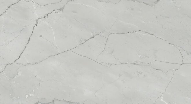 Close-up of light gray marble surface with natural veining patterns
