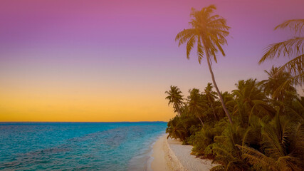 The landscape view of Paradise Island with Pink and Purple Tropical Sunset at Maldivian Dream Beach