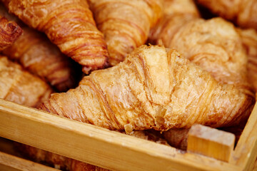 fresh croissant on a wooden table