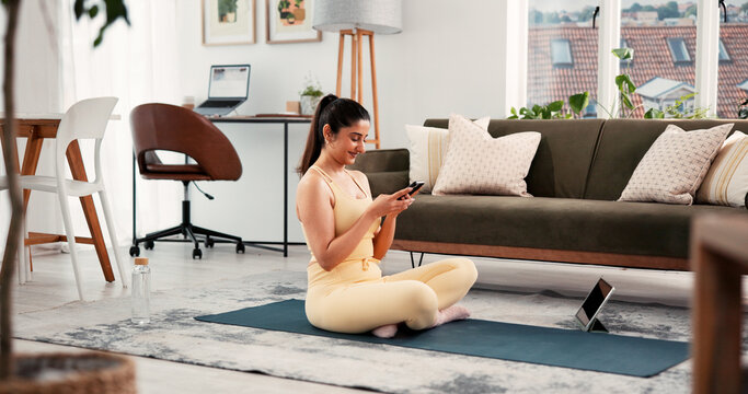 Fitness, home workout or woman typing with phone, exercise break or replying to message notification. Training pause, texting or person in lounge with mobile app, social media or post wellness status