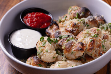 Garlic sticks and sauce on white plate