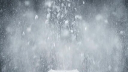 White powder scattering outwards from a central point in beautiful slow motion patterns abstract, geometric, precision