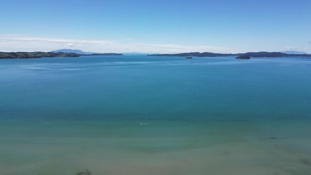 Cinematic Aerial View Pulling Back Over Ocean Near Snells Beach, New Zealand