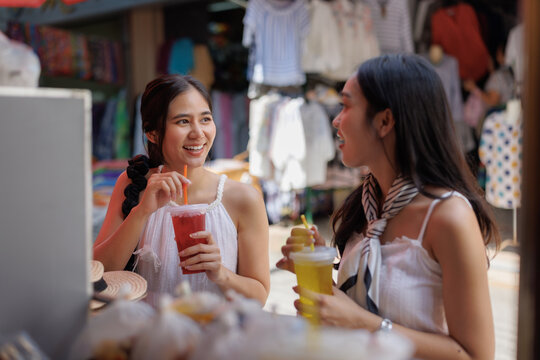 Young asian women enjoying drinks and conversation