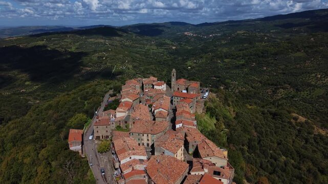 Montegiovi village Tuscany with historic stone houses overlooking open countryside landscape. Aerial