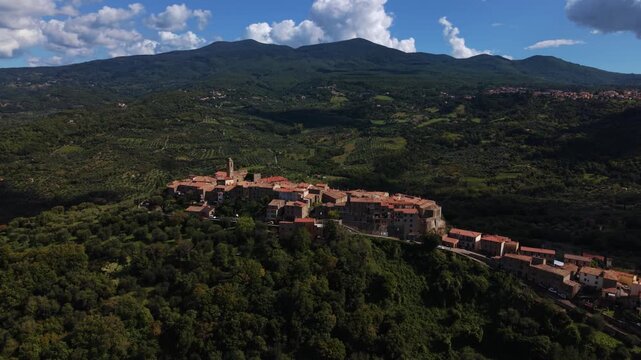 Aerial over Montegiovi village, Tuscany, Italy. Scenic historic houses on a hill near Monte Amiata
