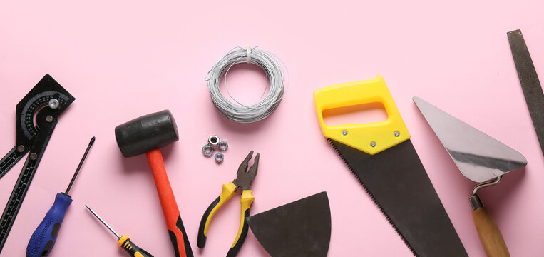 Wires and construction tools on pink background - Powered by Adobe
