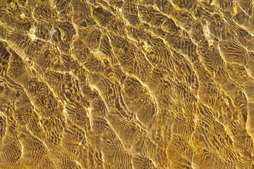 Clear water background, reflected ripple across the pool, top view of summer surface of swimming pool in brown color with sunlight, design for cosmetic product ,skincare wallpaper