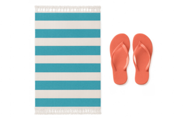 Striped beach towel and flip flops for summer vacation