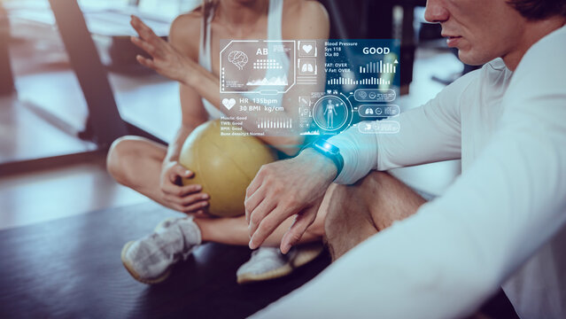 People in health club using Smart Watch tracking health information data display graphic interface overlay