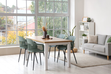 Interior of light room with pampas grass and coffee beans on dining table