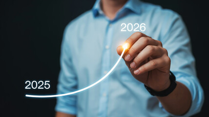 Businessman drawing an upward trend line from 2025 to 2028