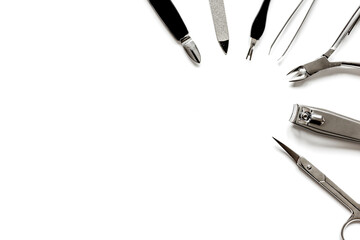Tools of a manicure set on white background top view