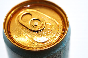 Blue can with droplets in close-up view