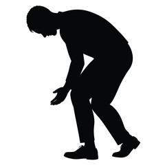 Man silhouette bending down picking something from ground searching lost item