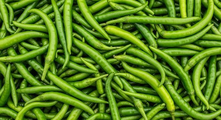 Abundant Pile of Fresh Green Serrano Peppers Filling the Frame