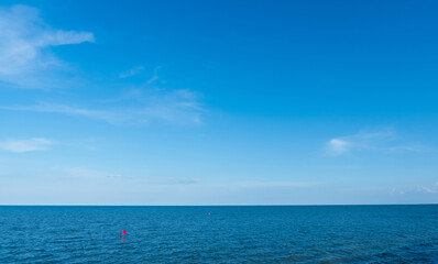 Obraz premium Sky on Sea Blue Ocean Background,Horizon Clam Sea Water By Beach and Cloud in Sunny day Summer,Landscape Clear Morning Sunrise Sky with Soft Light,Spring Nature in afternoon for environment backdrop 