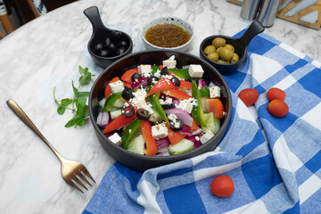 A delicious Greek salad with tomatoes, feta cheese, and olives
