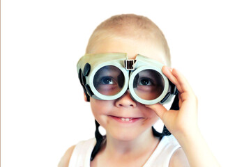A boy in funny retro swimming goggles on a white background.