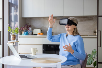 Senior woman wearing a vr headset, interacting with virtual elements and exploring the metaverse from her home kitchen, enjoying modern technology and futuristic entertainment