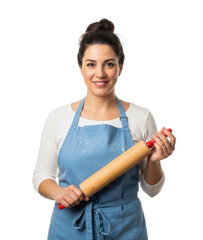 A smiling woman in a blue apron holds a wooden rolling pin, ready to bake.