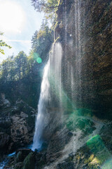 Peričnik Waterfall in Slovenia with Mist and Sunlight from Behind