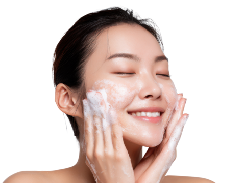 Glowing Skin Ritual: A woman finds her inner peace, eyes closed, as she cradles her face, gently washing it with a cleanser, embodying the beauty of self-care.