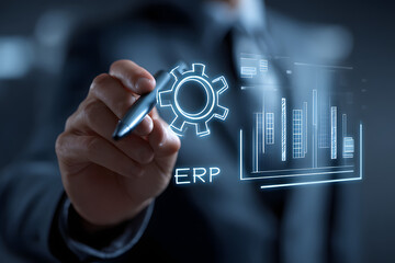 Business, Technology, Internet and network concept. Young businessman working on a virtual screen of the future and sees the inscription: ERP