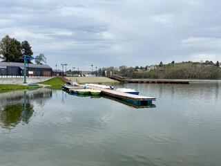 View of pier at pond, Nevyansk Russia - Solo travel concept. Handmade phone photo, selective focus, no AI
