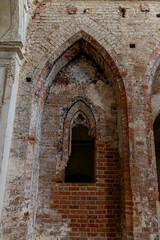 Fototapeta premium Cistercian Abbey Lubiaz in Poland. An ancient, dilapidated red brick arch. lubiaz Abbey.