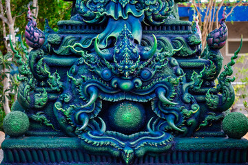 Background of Thailand's Chonburi religious attractions (Wat Khao Phra Khru viewpoint), with beautiful Buddha and Phaya Naga statues, tourists always come to make merit and take pictures at night.