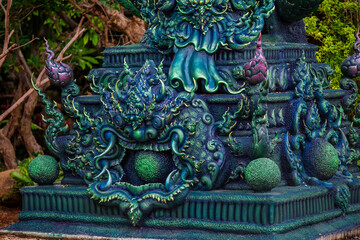 Background of Thailand's Chonburi religious attractions (Wat Khao Phra Khru viewpoint), with beautiful Buddha and Phaya Naga statues, tourists always come to make merit and take pictures at night.