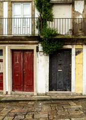 Exterior view of a building with two doors and a balcony