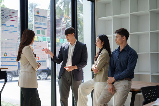 Business people collaborating discussing marketing sales data